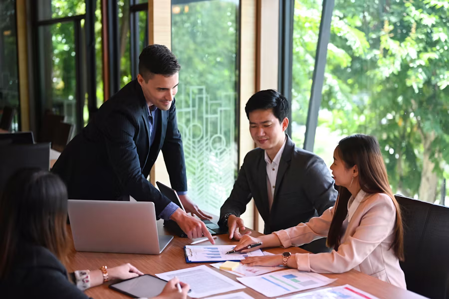 A team working together on a company project inside a business office.